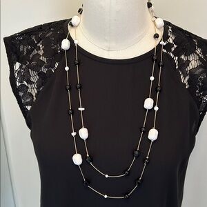 Fashion Jewelry Black and White Long Beaded Necklace on gold chain.